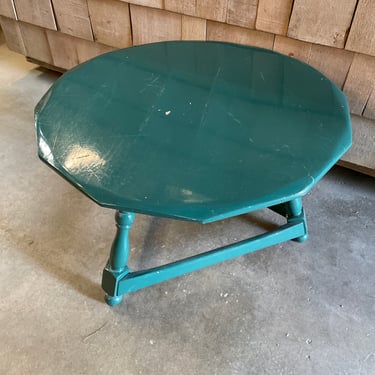Small roundish three legged turquoise table, H17” x 26” diameter