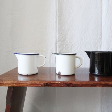 Enamel jug, enameled pitcher, old kitchen utensils 