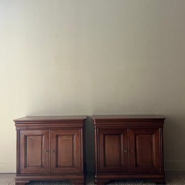 Pair of walnut nightstands. Sold together.