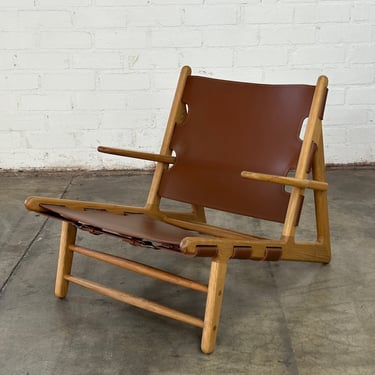 Contemporary leather and oak lounger 