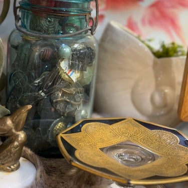 Patterned black and gold glass pedestal dish
