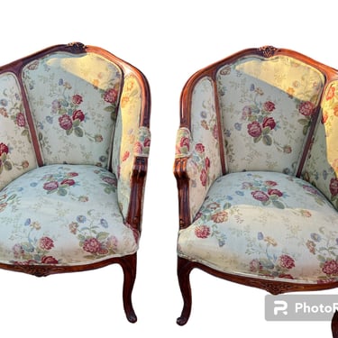 A pair of vintage floral design French inspired chairs 