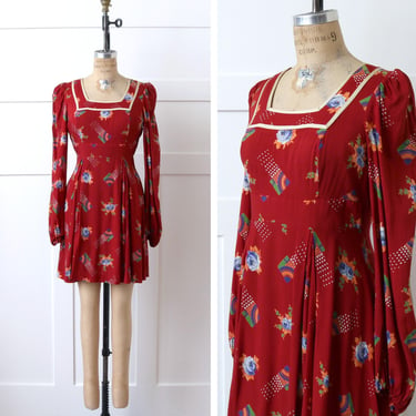 vintage 1970s Jodi T boho dress • abstract rainbows & blue rose print • brick red rayon dress 