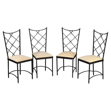 A set of four French wrought iron and brass chairs in the manner of Andre Arbus.