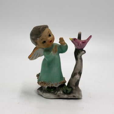 vintage angel with bird figurine 
