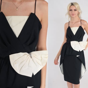 ariana grande black feather dress THE NEW ARRIVALS -LIA PEPLUM DRESS IN TEMPLE WHITE – The Loft Bridal main image 0