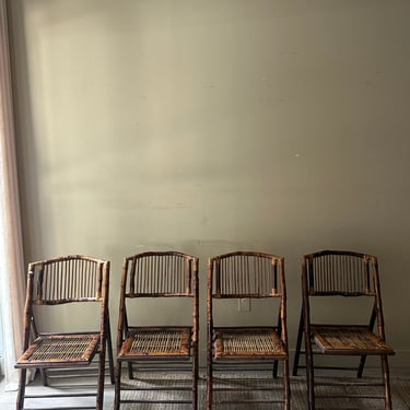 Scorched bamboo folding chairs. Sold in pairs.