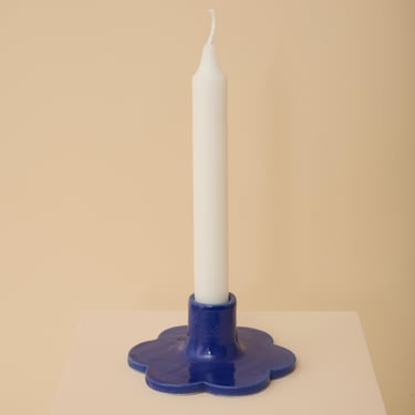 Blue handmade ceramic candle holder with scalloped edge 