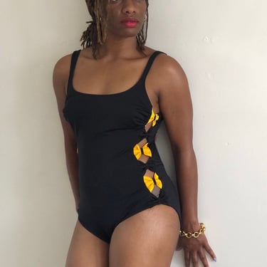 90s cut out swimsuit / vintage black one piece maillot swimsuit with side peek a boo cutaway yellow bows | Small Medium 