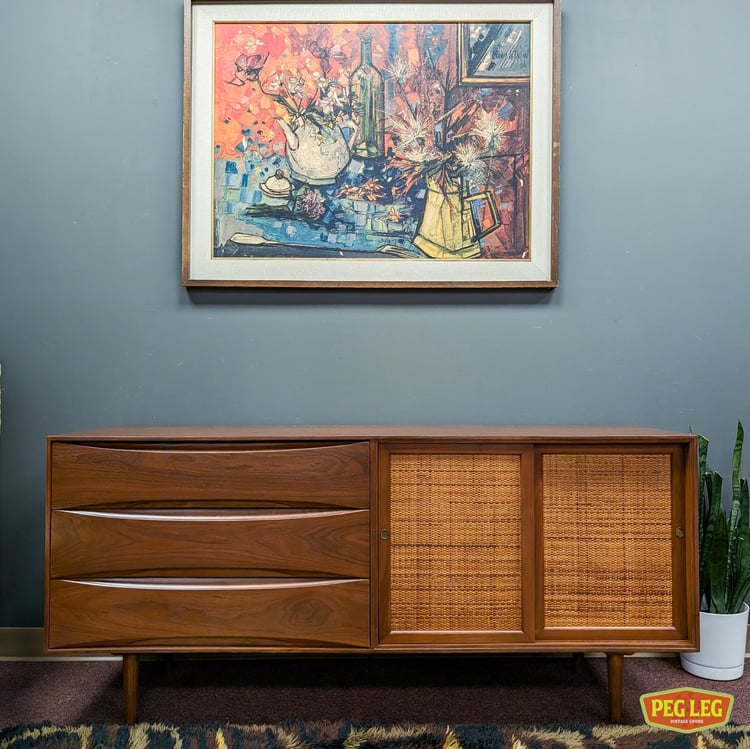 Mid-Century Modern walnut credenza with sliding cane doors