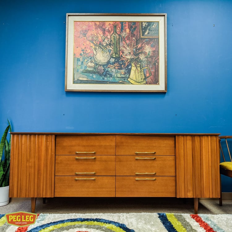 Mid-Century Modern walnut 12-drawer dresser with brass pulls by Young Furniture