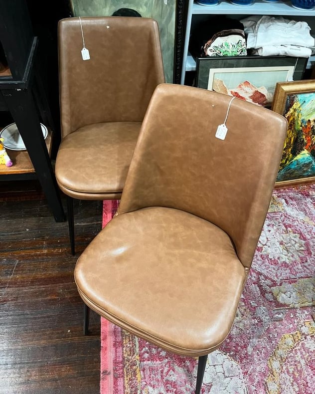 Brown vinyl side chairs. 2 available. 19” x 20” x 33” seat height 18.5” 