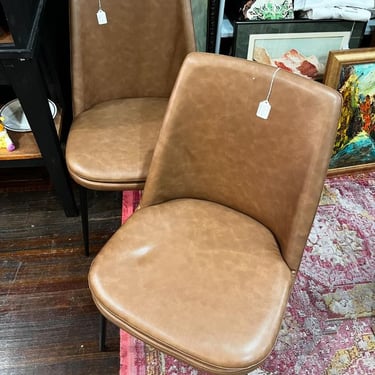 Brown vinyl side chairs. 2 available. 19” x 20” x 33” seat height 18.5” 