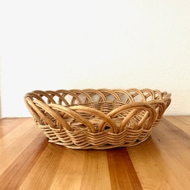1980's woven natural round wicker low profile basket 