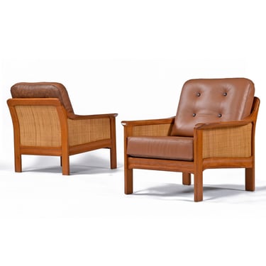 Pair of Solid Teak and Leather Lounge Chairs with Caned Sides and Reversible Cushions 