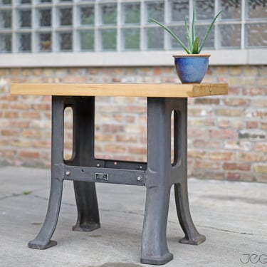 restored vintage industrial side table: repurposed cast iron machine base by Harris Machinery Co., thick wood slab 
