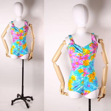 Late 1970s Early 1980s Blue, Pink and Orange Floral Ruched One Piece Swimsuit by Maxine of Hollywood 