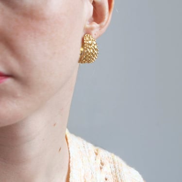 Textured gold tone hoop clip on earrings 