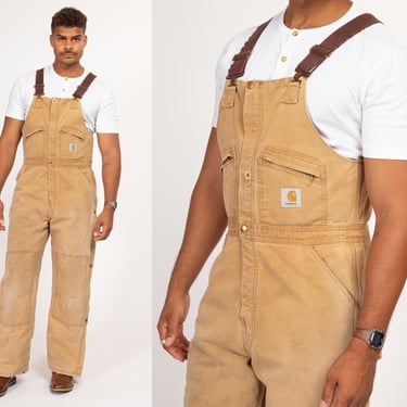 38x32 90s Carhartt Insulated Quilt Lined Overalls | Vintage Union Made In USA Faded Tan Distressed Workwear Jumpsuit 