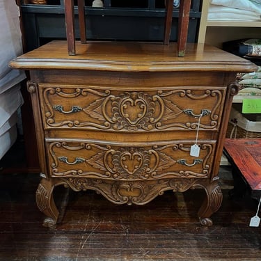 Carved wood two drawer nightstand. 28” x 20” x 25.5” 