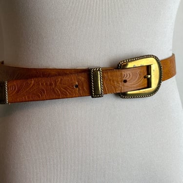 Vintage leather western belt thin golden brown tooled belt with shiny gold tone buckle and tip~ women’s size small up to 25”- 28” waist 