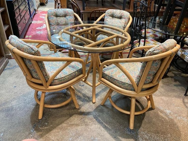 Sweet 5 piece set. Glass top rattan table and four chairs that swivel! Table is 41” x 28.5” Chairs are 21.5” x 19” x 32” seat height…