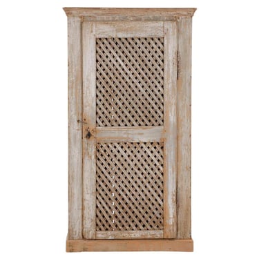 A rustic painted pine one-door cabinet, early 19th C.