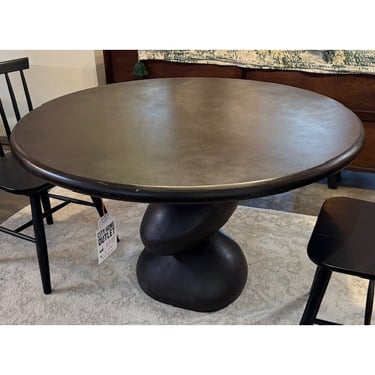 Round Dining Table with Abstract Base