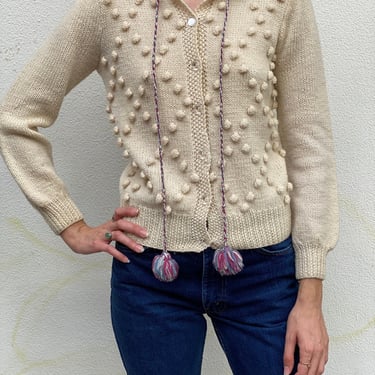Vintage Knubby Cardigan Sweater / Popcorn Knit Sweater / Clear Plastic Buttons with Drawstring Neckline and Pom Moms 