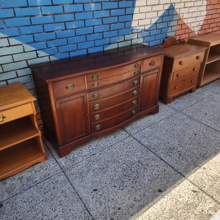 Beautiful Mahogany, unusual 2/3 width top drawer, pair of double drawers beneath, end doors w movable shelf. 58x20x34" tall.