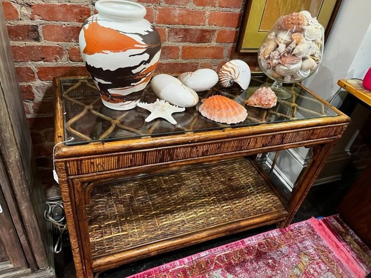 Rattan and glass console table, 42” x 18” x 28.5” 