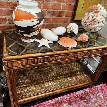 Rattan and glass console table, 42” x 18” x 28.5” 