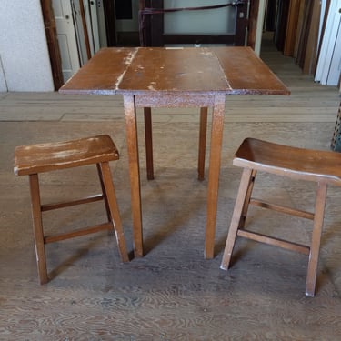 Tall drop leaf table and two tall stools  36