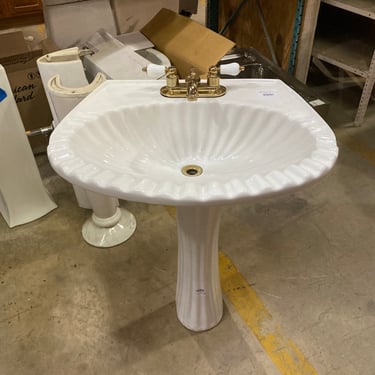 White Pedestal Sink with Brass Hardware