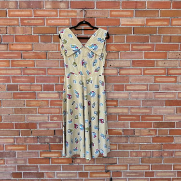 vintage 50s yellow fit and flare passport stamp print dress / 28.5 waist s m small medium 