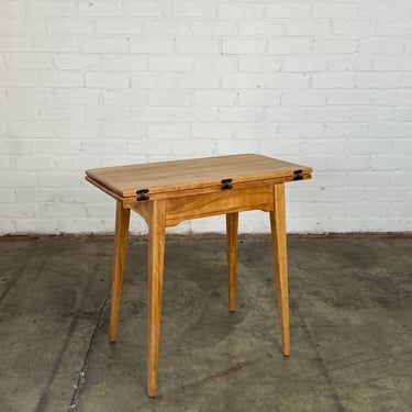 Compact flip top table by Cushman 