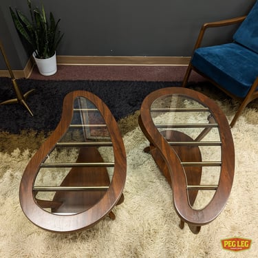 Pair of Mid-Century Modern walnut and glass kidney-shaped side tables