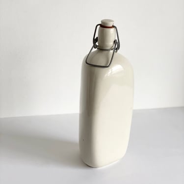 vintage French stoneware bottle, triangular with porcelain lid