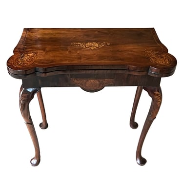 Early Queen Anne period carved walnut lift-top games table