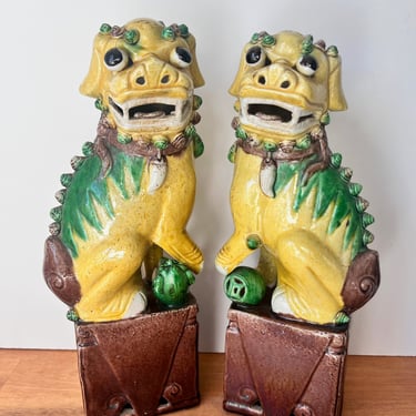 Vintage Pair of Glazed Ceramic Chinese Foo Dogs. 20th Century Imperial Yellow and Green Dogs on Pedestals. 
