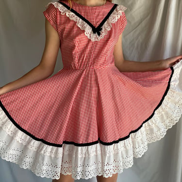 60s Square Dancing Dress / Little Red and White Check Picnic Print / White Eyelet Lace / Puffed Short Sleeves / Black Velvet Bow 