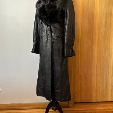 70’s black leather coat~ full length long fitted overcoat~ large black fur collar~ nipped waist 70’s Glam- Rock size M/L 