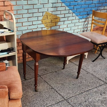 Solid Walnut Drop Leaf Dining Table. American Empire style. Oval shape with leaves up. 39x45x29