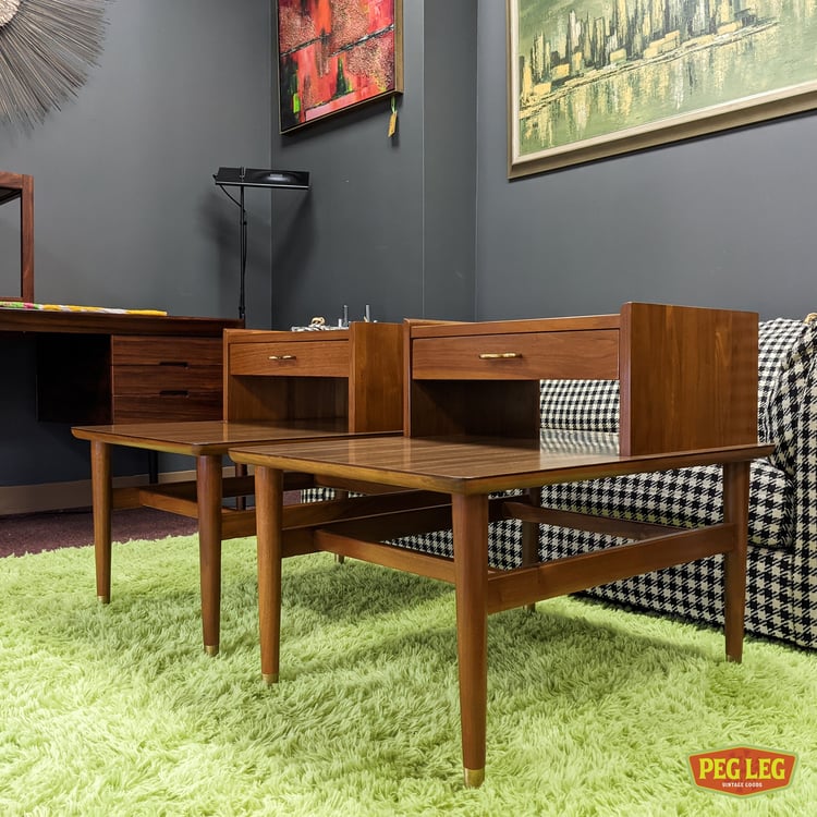 Mid Century Modern pair of step tables with brass details and laminate tops