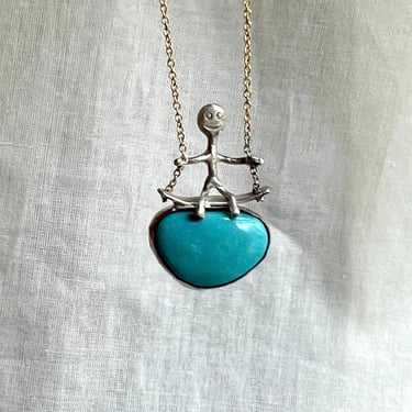 Swinging on a Turquoise Quirky Pendant in Handmade Sterling Silver on an america turquoise 
