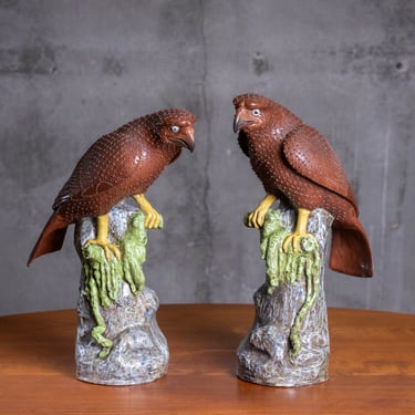 PAIR OF PORCELAIN EAGLES PERCHED ON ROCKS