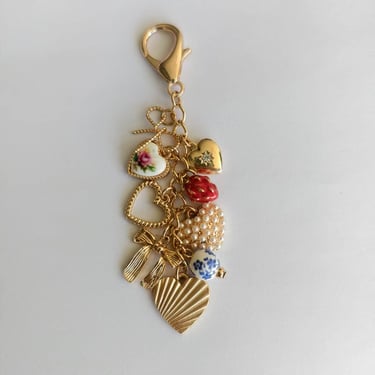 PORCELAIN BOWS HEARTS PEARL STRAWBERRY BAG CHARM | 80K008