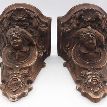 Pair of Highly Carved Figural Brown Plaster Wall Shelves