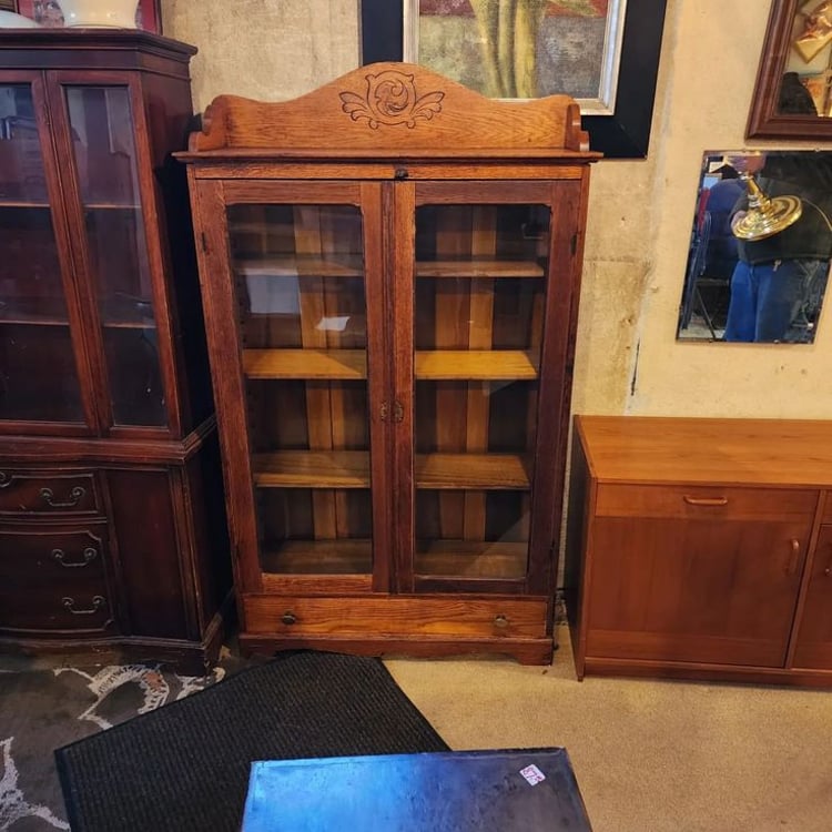 Oak Glass Front Bookcase. 41x13x69" tall. Adjustable Shelves, bottom drawer.