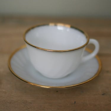 vintage fire king cup and saucer white with gold trim 